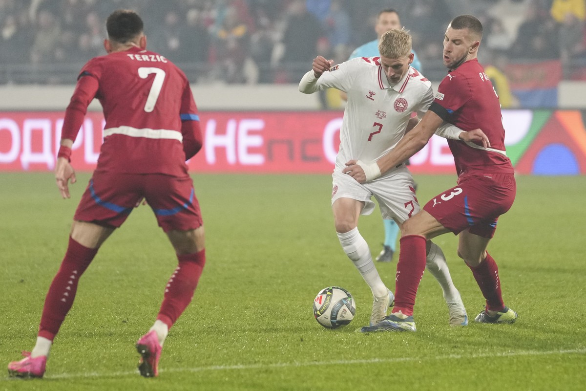 Serbia's Strahinja Pavlovic holds Denmark's Albert Gronbaek during the UEFA Nations League soccer match between Serbia and Denmark at the Dubocica Stadium in Leskovac, Serbia, Monday, Nov. 1 ...