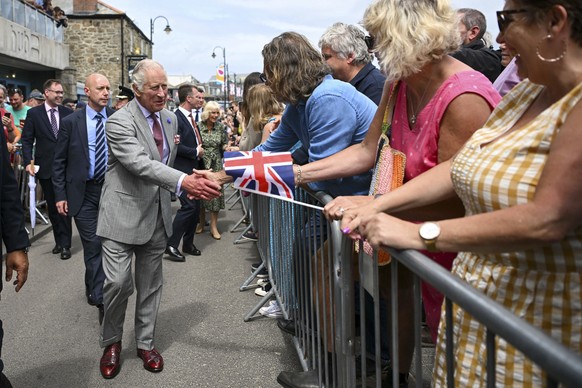 Britain&#039;s King Charles III meets members of the public during a visit to St Ives Harbour, Cornwall, England, to meet members of the Cornish community, Thursday July 13, 2023. (Finnbarr Webster/PA ...
