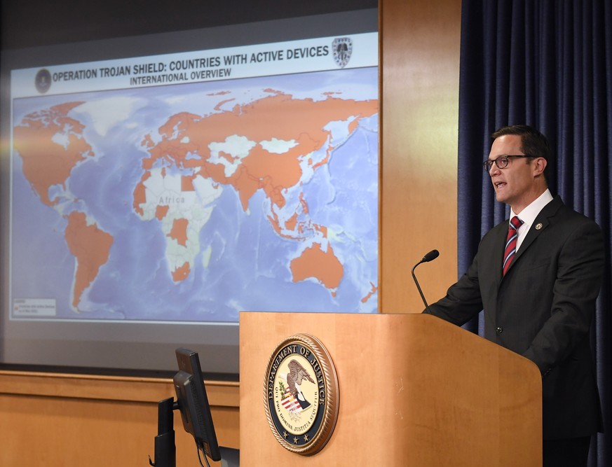 Acting U.S. Attorney Randy Grossman speaks at a news conference announcing Operation Trojan shield, Tuesday, June 8, 2021, in San Diego. The global sting operation involved an encrypted communications ...