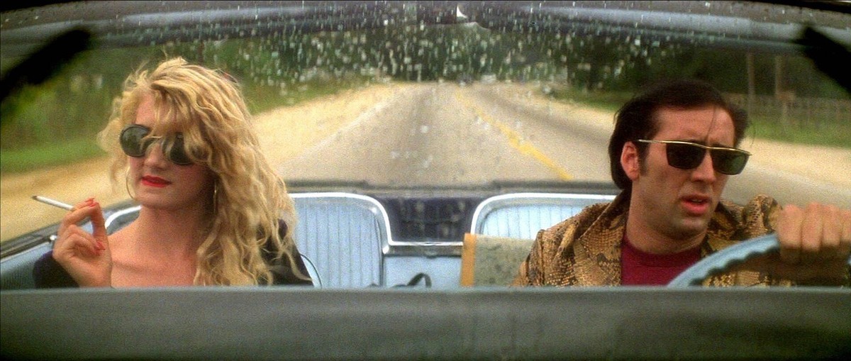 Laura Dern &amp; Nicolas Cage Characters: Lula Fortune, Sailor Ripley Film: Wild At Heart USA 1990 / 1965 Ford Thunderbird / Literaturverfilmung Based On The Book By Barry Gifford Director: David Lync ...