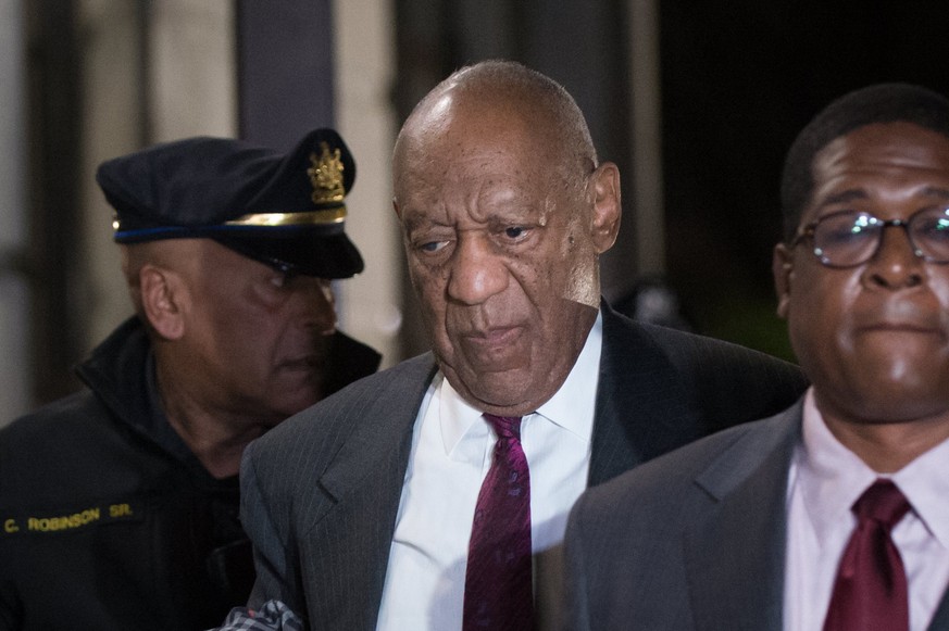 epa06694773 (FILE) - US entertainer Bill Cosby (C) departs the Montgomery County Courthouse in Norristown, Pennsylvania, USA, 25 April 2018 (issued 26 April 2018). Jury has reached a verdict in Bill C ...