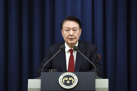 In this photo provided by South Korea Presidential Office, South Korean President Yoon Suk Yeol speaks during a press briefing at the presidential office in Seoul, South Korea, Tuesday, Dec. 3, 2024.  ...