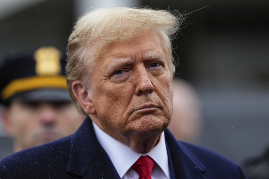 Former President Donald Trump listens during a news conference after attending the wake of New York City police officer Jonathan Diller, Thursday, March 28, 2024, in Massapequa Park, N.Y. Diller was s ...