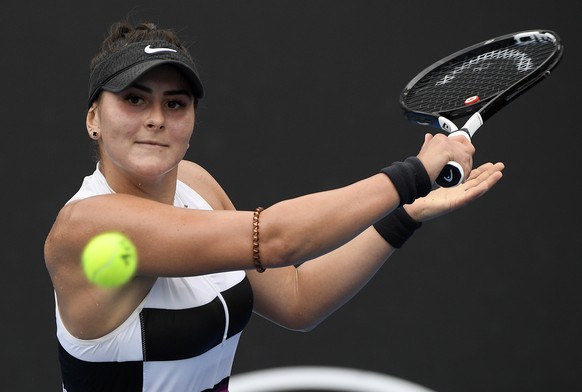 Canada&#039;s Bianca Andreescu makes a backhand return to United States&#039; Whitney Osuigwe during their first round match at the Australian Open tennis championships in Melbourne, Australia, Tuesda ...