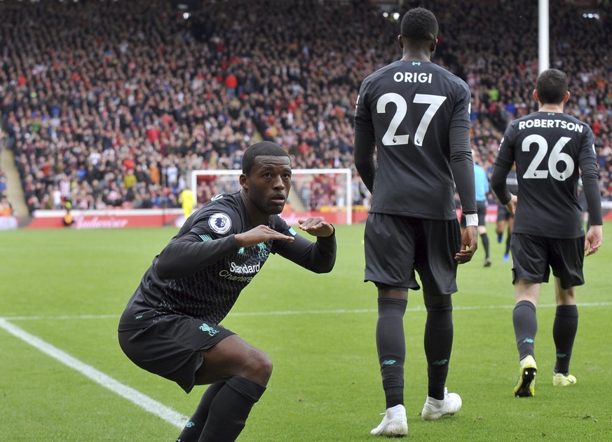 Liverpool&#039;s Georginio Wijnaldum, left, celebrates after scoring his side&#039;s opening goal during the English Premier League soccer match between Sheffield United and Liverpool at Bramall Lane  ...