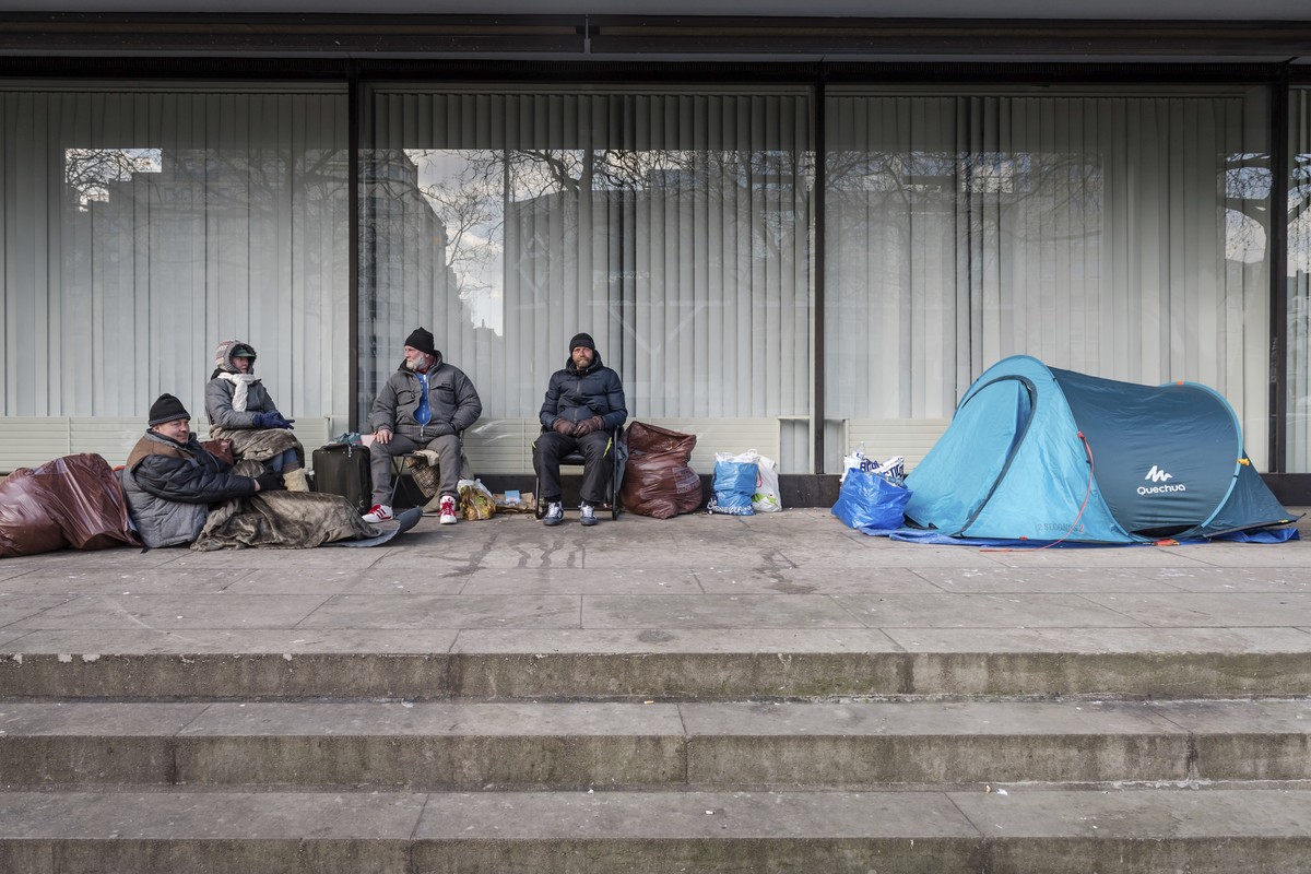 A group of homeless people from Poland, who do not want to go to a shelter, camp under a building in the center of Brussels on Tuesday, Feb. 27, 2018. As a cold snap grips Europe, authorities in Bruss ...