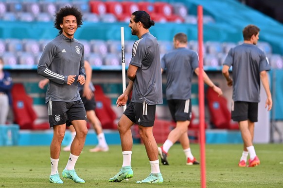 epa09271253 Germany?s Leroy Sane (L) and Emre Can (C) during the German national soccer team&#039;s training session in Munich, Germany, 14 June 2021. Germany will face France in their UEFA EURO 2020  ...