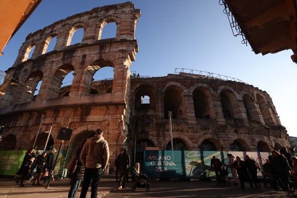 epa12766283 A fence with Olympic branding surrounds the Verona Arena Roman amphitheatre during the Milano Cortina 2026 Winter Olympic Games, in Verona, Italy, 21 February 2026. The historic Verona Are ...