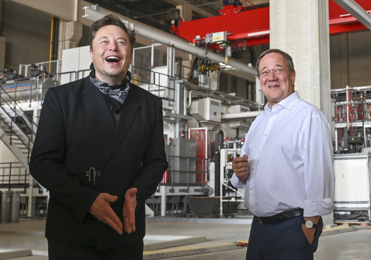 Germany's center-right candidate to replace Angela Merkel as chancellor in the upcoming elections and Christian Democratic Union chairman, Armin Laschet, right, talks to Elon Musk, Tesla CEO, dur ...