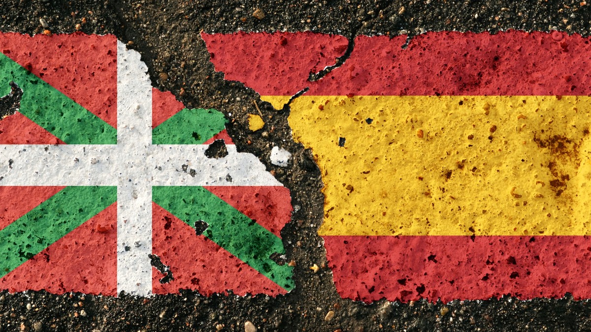 On the pavement there are images of the flags of the Basque Country and Spain, as a confrontation between the two countries. Conceptual image. xkwx Basque, Country, vs, Spain, together, flag, peace, c ...