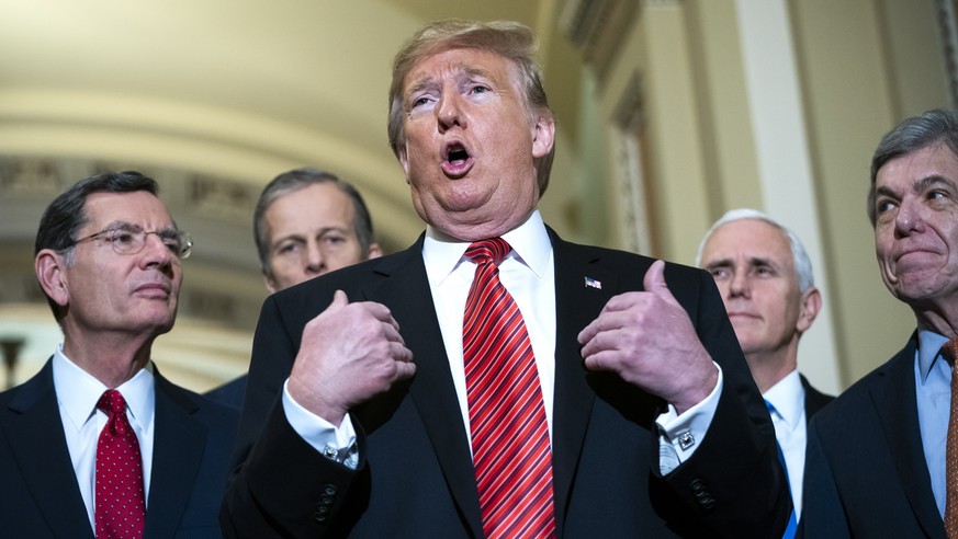 epaselect epa07271920 US President Donald J. Trump (C), along with Vice President Mike Pence (C-R) and Senate Republicans, speaks to the media after attending the Senate Republican policy luncheon in  ...