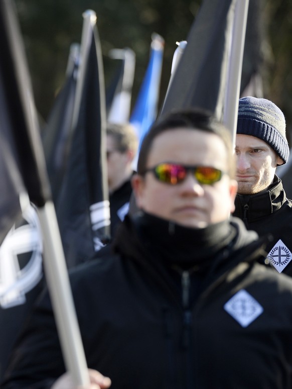 epa08203618 Following the call of two Hungarian extreme right organizations Legio Hungaria and Hungarian Hammerskins, some 500 Hungarian and foreign, among them German, demonstrators march in a park t ...