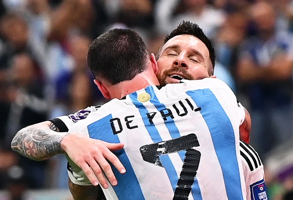 epa10364296 Argentinian players Lionel Messi (R) and Rodrigo de Paul (L) celebrate their team&#039;s 3-0 lead during the FIFA World Cup 2022 semi final between Argentina and Croatia at Lusail Stadium  ...