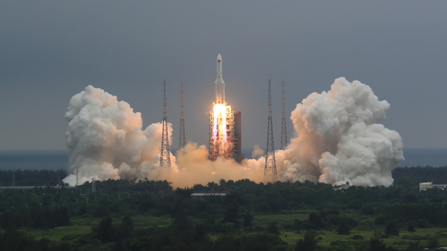 FILE - In this April 29, 2021, file photo released by China&#039;s Xinhua News Agency, a Long March 5B rocket carrying a module for a Chinese space station lifts off from the Wenchang Spacecraft Launc ...