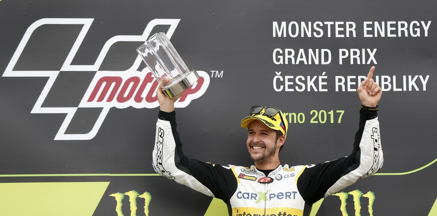 Switzerland&#039;s Moto2 rider Thomas Luthi of the CarXpert Interwetten celebrates his victory in the Moto2 race at the Czech Republic motorcycle Grand Prix at the Automotodrom Brno, in Brno, Czech Re ...