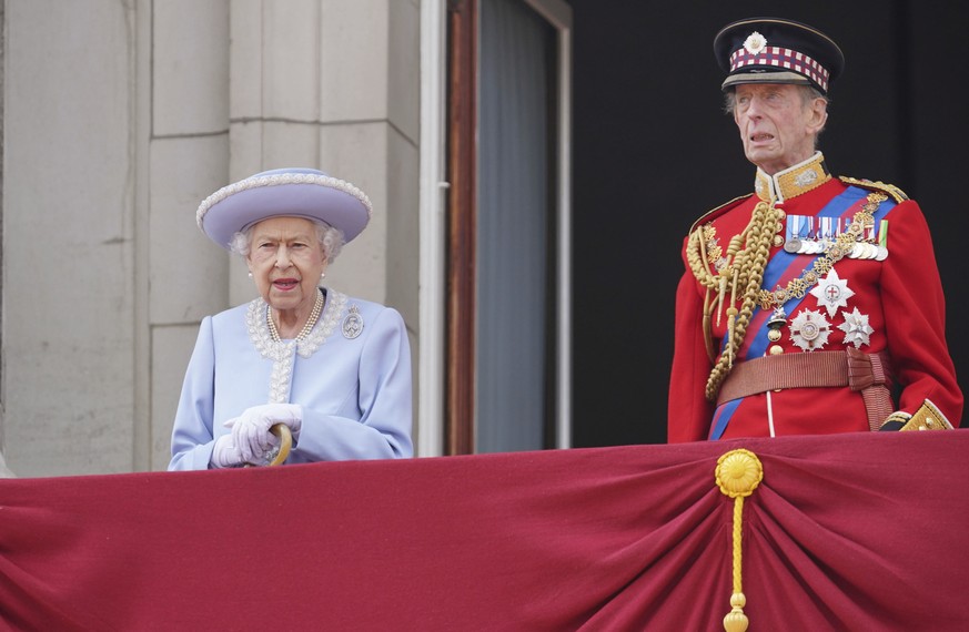 Queen Elizabeth II and the Duke of Kent watch from the balcony during the Trooping the Color ceremony at Horse Guards Parade in London, Thursday, June 2, 2022, on the first of four days of celebration ...