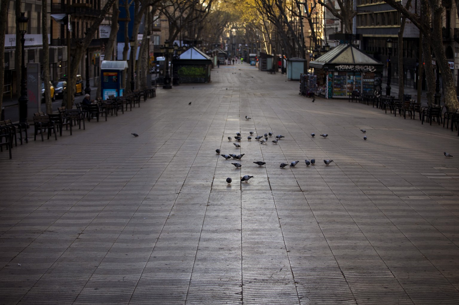 La Ramblas is seen empty in Barcelona, Spain, Sunday, March 15, 2020. Spain's government announced Saturday that it is placing tight restrictions on movements and closing restaurants and other establi ...