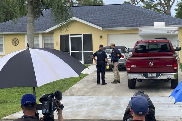 Law enforcement officials investigate home of a young man wanted for questioning in the disappearance of his girlfriend, Gabby Petito, on Monday, Sept. 20, 2021 in North Port, Fla. The officers served ...