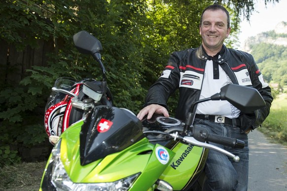 Walter Wobmann, member of the National Council and president of Swiss Moto FMS, takes part in a convention with his motorcycle, in Trimbach, Switzerland, on July 2, 2015. (KEYSTONE/Peter Schneider)

W ...