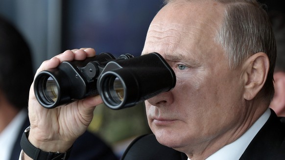 FILE - Russian President Vladimir Putin holds binoculars while watching the military exercises Center-2019 at Donguz shooting range near Orenburg, Russia, on Sept. 20, 2019. Russia&#039;s present dema ...