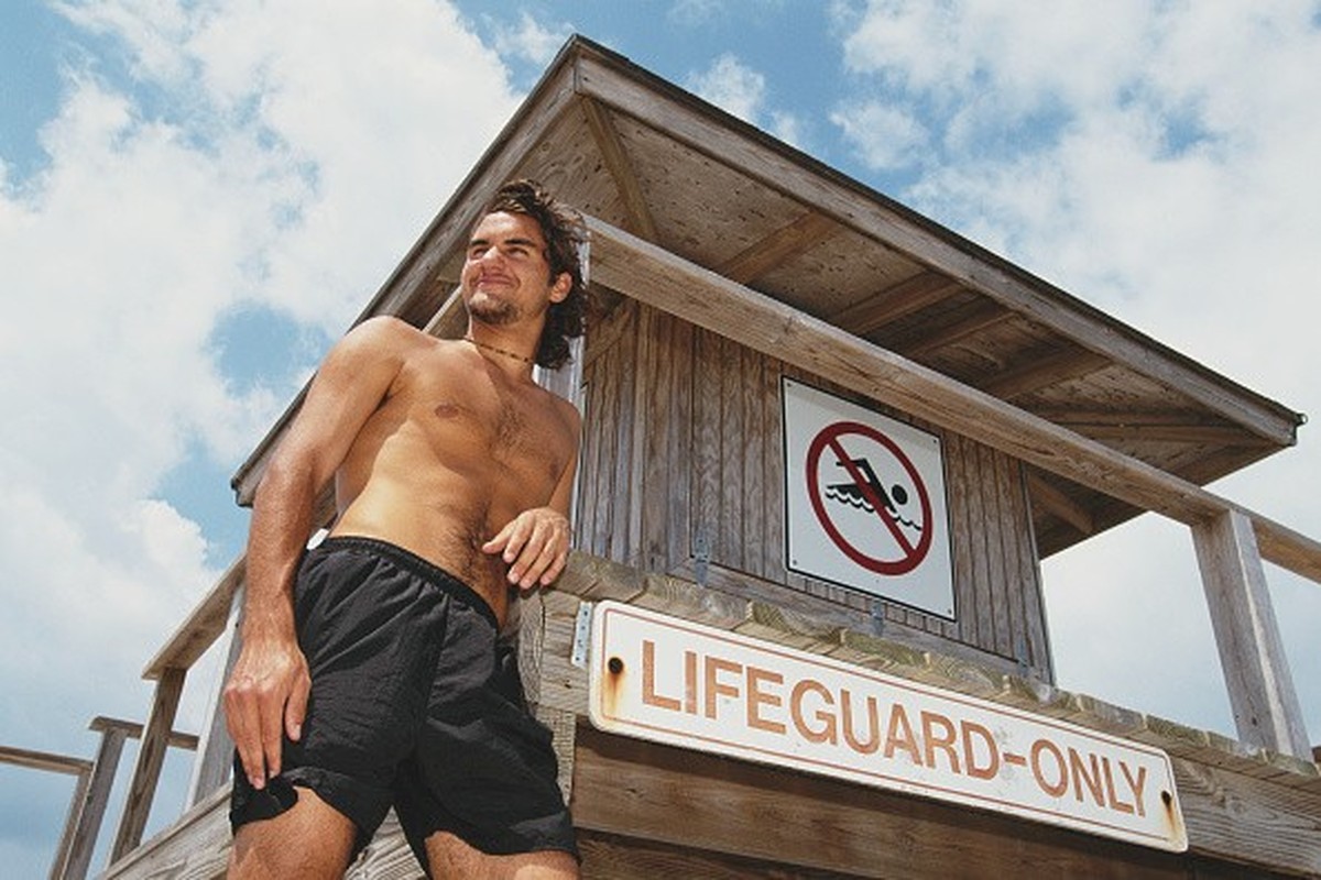 Roger Federer of Switzerland poses next to a Lifeguard post on the beach at the ATP Ericsson Open Tennis Championship on 27 March 2000 in Key Biscayne, Florida, United States. (Photo by Clive Brunskil ...