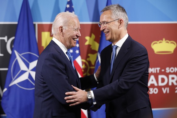 epaselect epa10040349 NATO Secretary-General, Jens Stoltenberg (R), shakes hands with US President, Joe Biden (L), during their bilateral meeting held on the first day of the NATO summit at IFEMA cong ...