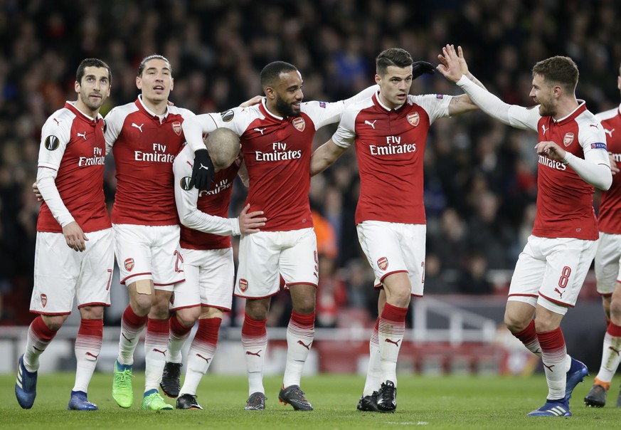 Arsenal&#039;s Alexandre Lacazette, 3rd left, celebrates with teammates after scoring his sides fourth goal during the Europa League quarterfinal, first leg soccer match between Arsenal and CSKA Mosco ...