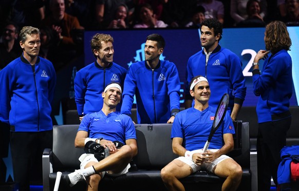 epa10202673 Team Europe double Roger Federer (R) of Switzerland and Rafael Nadal of Spain sit in front of teammates (from L) Team Europe vice captain Thomas Enqvist of Sweden, Casper Ruud of Norway, N ...