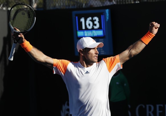 Germany&#039;s Mischa Zverev celebrates after defeating United States&#039; John Isner in their second round match at the Australian Open tennis championships in Melbourne, Australia, Wednesday, Jan.  ...