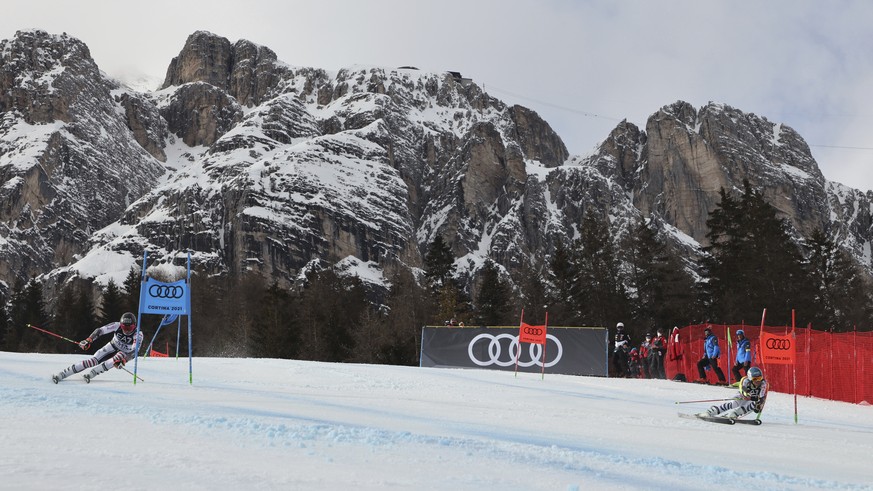 France&#039;s Mathieu Faivre, left, and Germany&#039;s Alexander Schmid speed down the course during a parallel slalom, at the alpine ski World Championships, in Cortina d&#039;Ampezzo, Italy, Tuesday ...