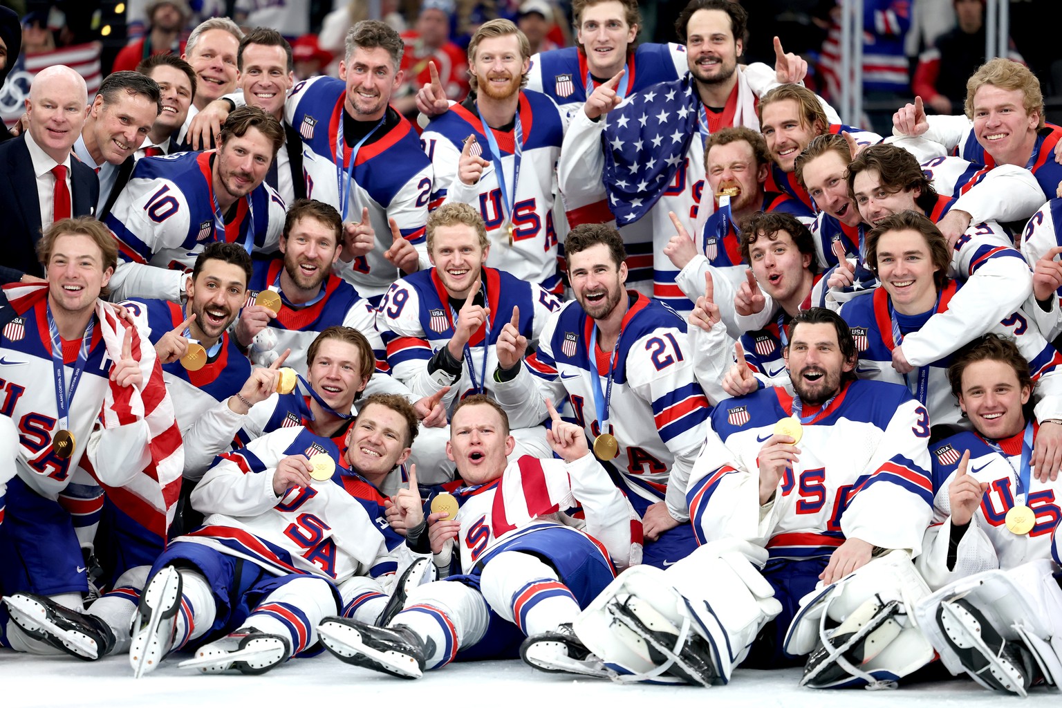 epaselect epa12768958 Gold medalists Team USA celebrate during the medal ceremony for the Men's Ice Hockey at the Milano Cortina 2026 Winter Olympic Games in Milano, Italy, 22 February 2026. EPA/ ...