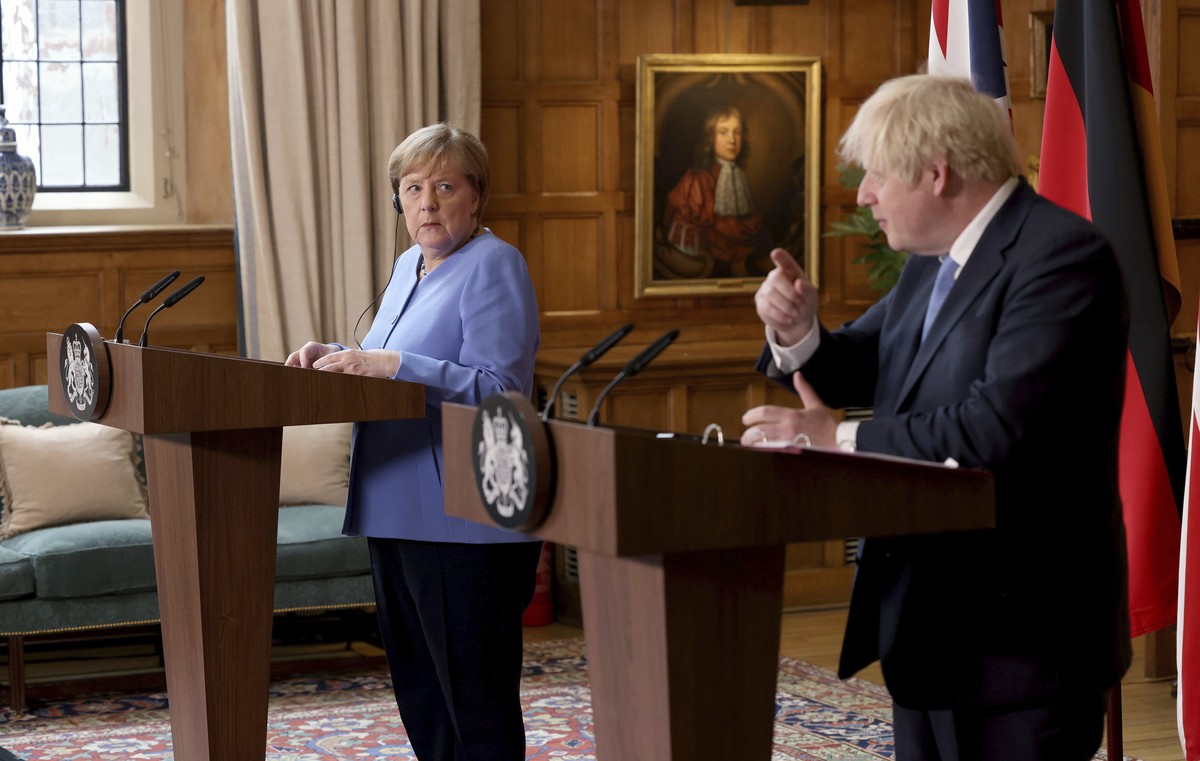 Britain's Prime Minister Boris Johnson, right and German Chancellor Angela Merkel, take part in a press conference after their meeting at Chequers, the country house of the Prime Minister, in Buc ...