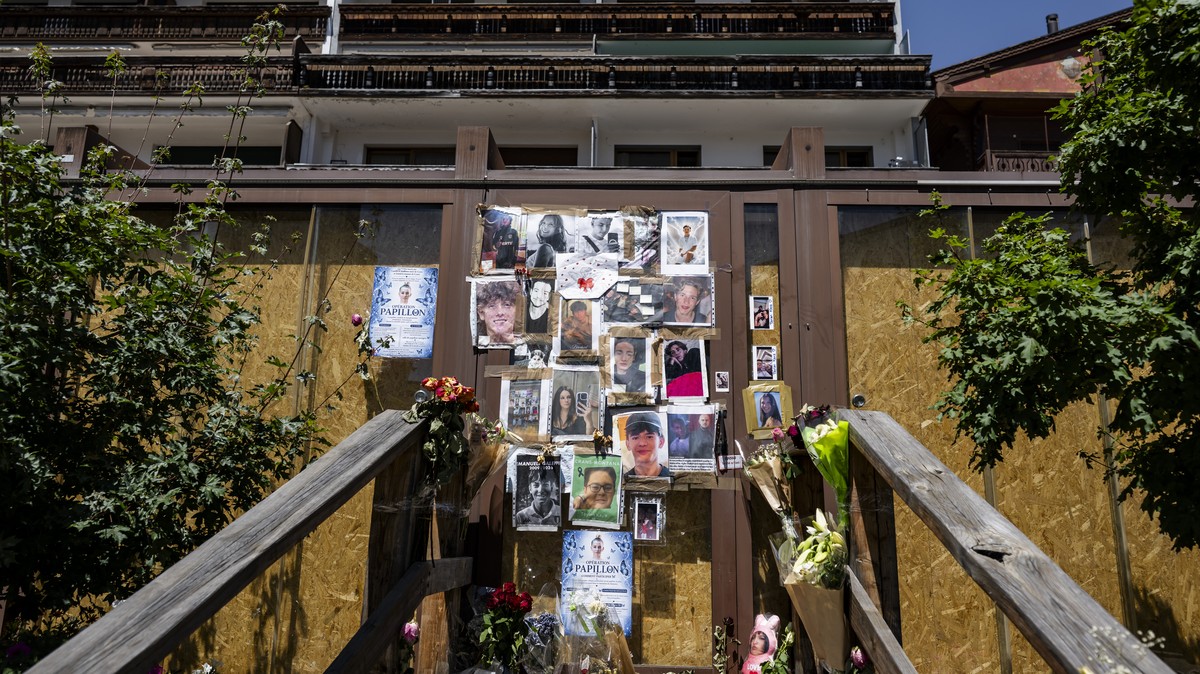 epaselect epa13100250 Portraits of the young victims are displayed at the entrance of the bar Le Constellation six months after a deadly fire, in Crans-Montana, Switzerland, 09 July 2026. Forty-one pe ...