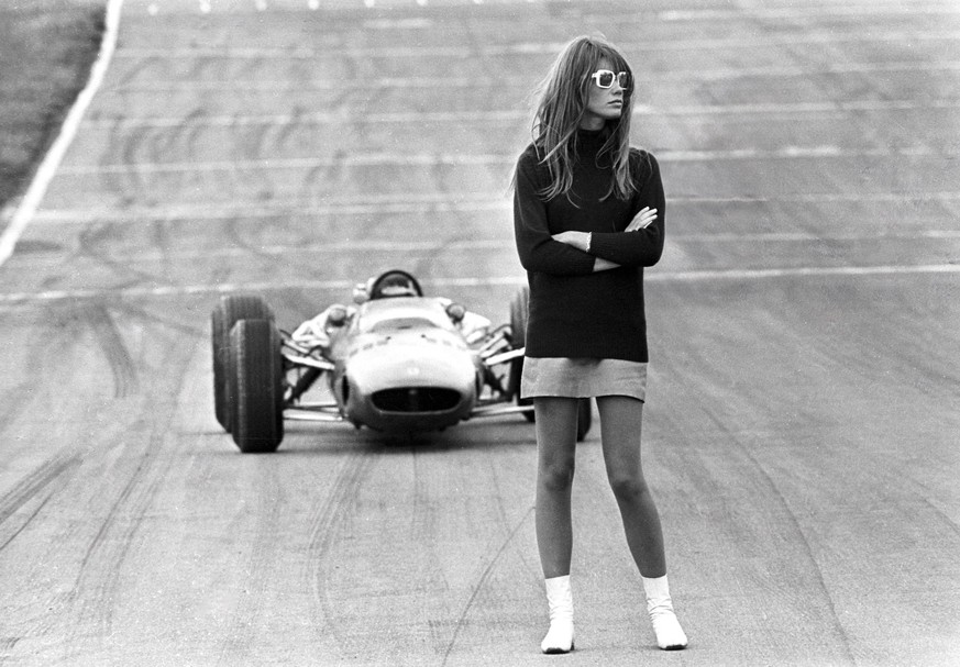 Look out , beautiful . Brands Hatch , England Nonchalent hazard for racing drivers is 22 year old French actress and teenagers idol , Francoise Hardy , claimed as the originator of the mini - skirt .  ...