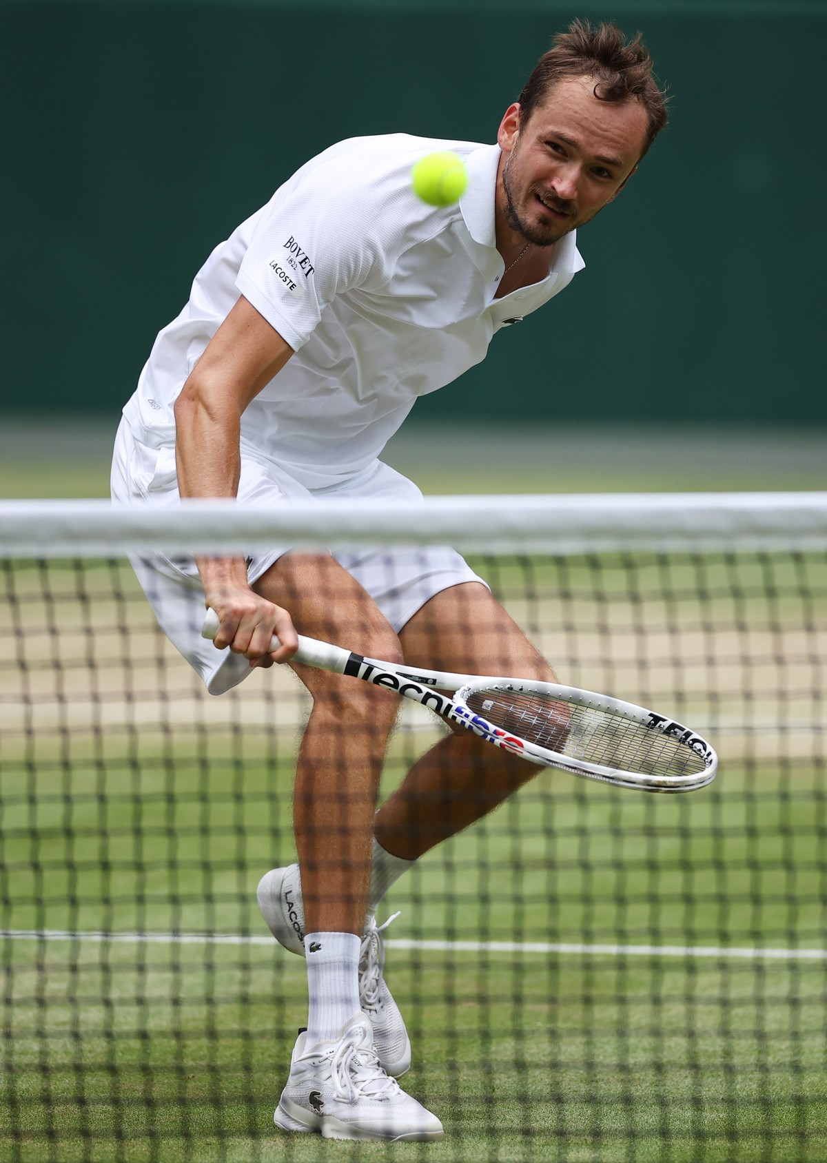 epa11474590 Daniil Medvedev of Russia in action during his Men's Singles semi-finals match against Carlos Alcaraz of Spain at the Wimbledon Championships, in Wimbledon, London, Britain, 12 July 2 ...
