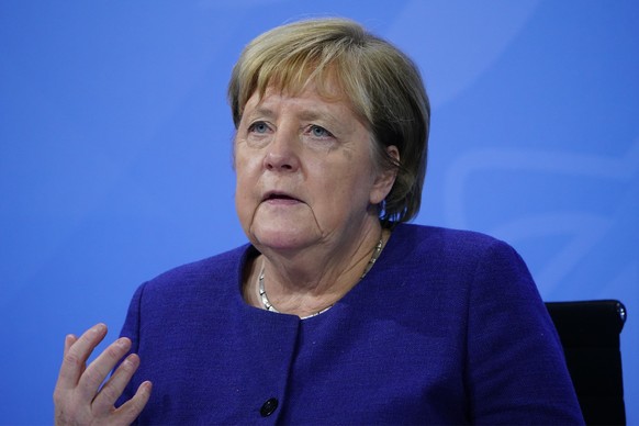 epa09589779 Acting German Chancellor Angela Merkel speaks during a press conference after a meeting between German State Premiers and acting Chancellor on the occasion of the current coronavirus situa ...