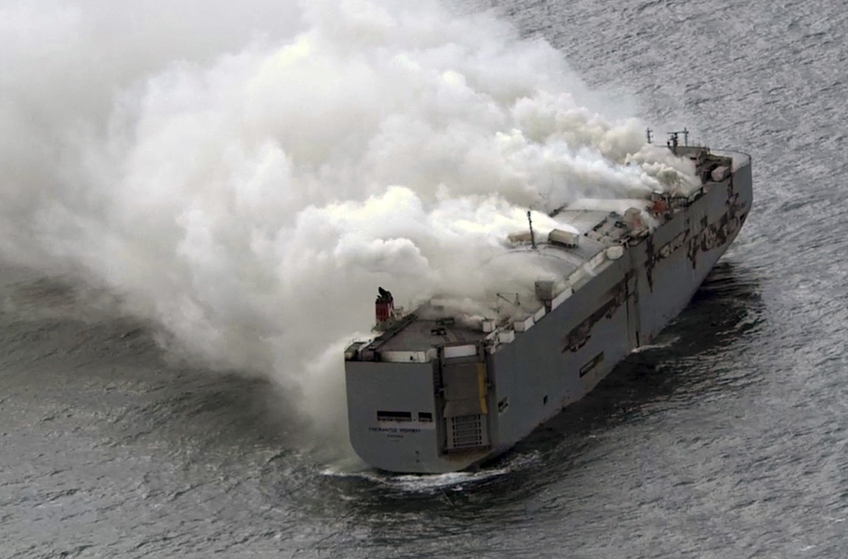 Smoke is seen from a freight ship in the North Sea, about 27 kilometers (17 miles) north of the Dutch island of Ameland, Wednesday, July 26, 2023. A fire on the freight ship Fremantle Highway, carryin ...