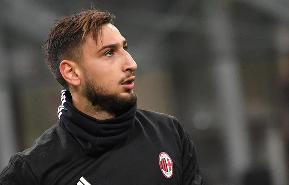 AC Milan goalkeeper Gianluigi Donnarumma walks on the pitch prior to the Italian Cup soccer match between AC Milan and Hellas Verona, at the Milan San Siro stadium, Italy, Wednesday, Dec. 13, 2017. (D ...