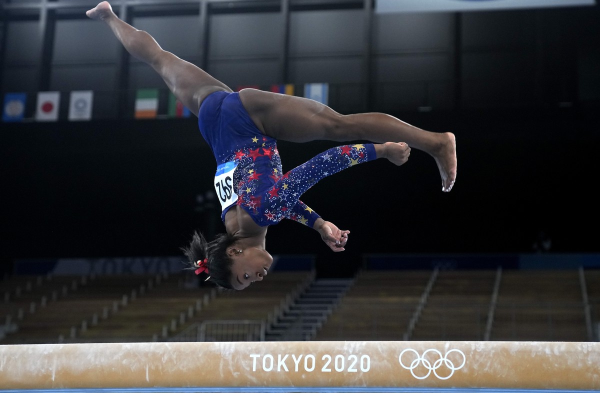 Simone Biles, of the United States, performs on the balance beam during the women's artistic gymnastic qualifications at the 2020 Summer Olympics, Sunday, July 25, 2021, in Tokyo. (AP Photo/Natac ...