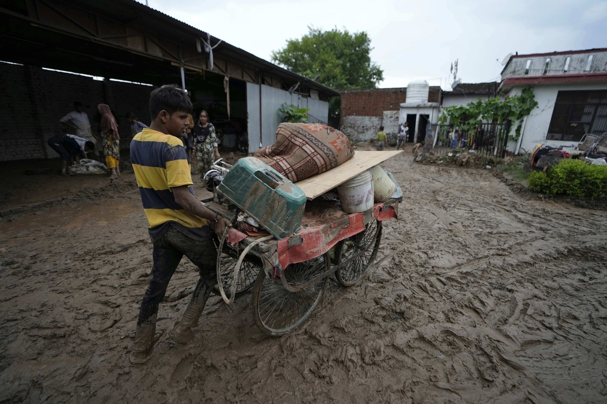 A man salvages belongings on a cart from the remains of a house damaged in flash floods in Jammu, India, Wednesday, Aug. 27, 2025. (AP Photo/Channi Anand)
India Flash Floods