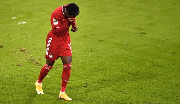 epa08943851 Bayern&#039;s Alphonso Davies reacts during the German Bundesliga soccer match between FC Bayern Muenchen and SC Freiburg at Allianz Arena in Munich, Germany, 17 January 2021. EPA/LUKAS BA ...