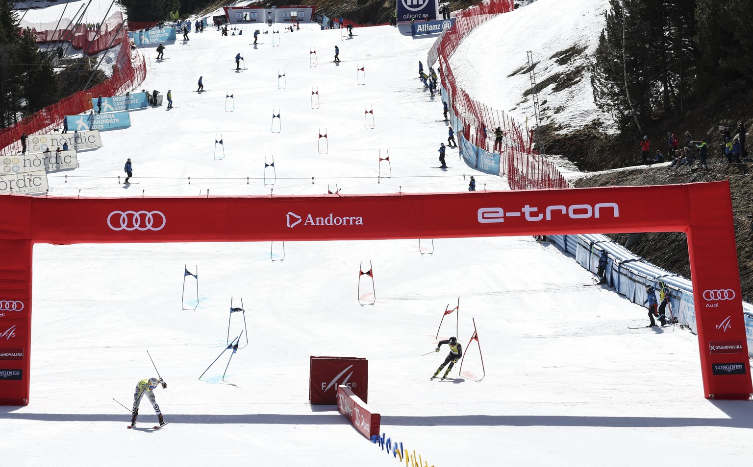 Germany&#039;s Linus Strasser, left, and Italy&#039;s Corrado Barbera compete during an alpine ski, mixed team World Cup event in Soldeu, Andorra, Friday, March 17, 2023. (AP Photo/Alessandro Trovati)