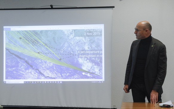 epa08119359 Yevhenii Dykhne, the president of Ukraine International Airlines (UIA) looks at a picture of Flightradar program during a press conference at Boryspil International Airport in Kiev, Ukrain ...