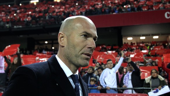 Real Madrid&#039;s coach Zinedin Zidane looks on during La Liga soccer match between Real Madrid and Sevilla at the Ramon Sanchez Pizjuan stadium, in Seville, Spain on Sunday, Jan. 15, 2017. (AP Photo ...