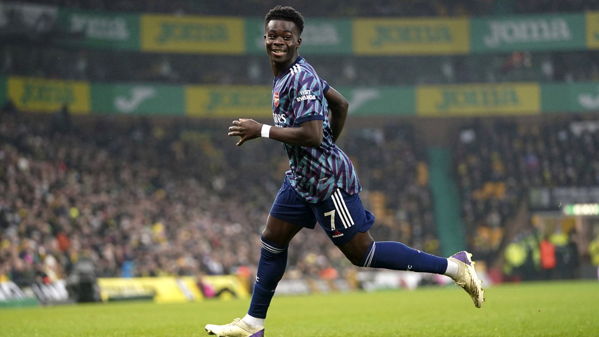 Arsenal's Bukayo Saka celebrates scoring during the English Premier League soccer match between Norwich City and Arsenal at Carrow Stadium, Norwich, England, Sunday Dec. 26, 2021. (Joe Giddens/PA ...