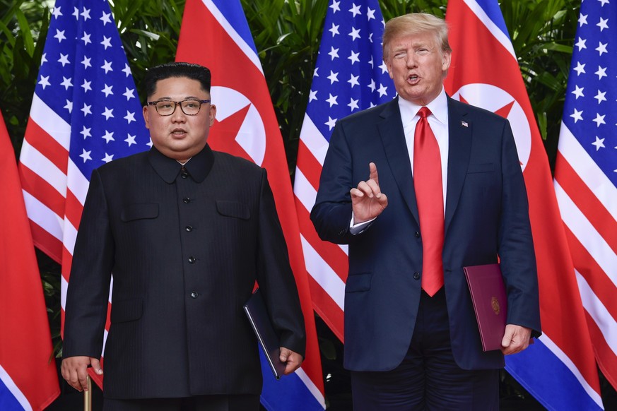 FILE - In this June 12, 2018, file photo, U.S. President Donald Trump makes a statement before saying goodbye to North Korea leader Kim Jong Un after their meetings at the Capella resort on Sentosa Is ...