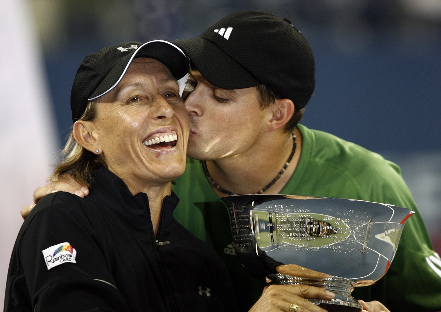 Bob Bryan, of the United States kisses Martina Navratilova of the U.S. after they won the mixed doubles championship over Kveta Peschke and Martin Damm of the Czech Republic at the US Open tennis tour ...