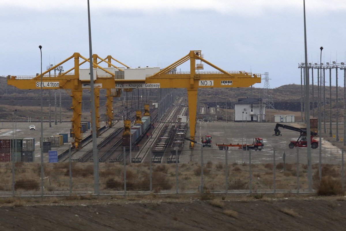 In this April 1, 2018, photo, vehicles work at the Khorgos Gateway, one of the world's largest dry dock in a remote crossing along Kazakhstan's border with China near Khorgos. Khorogs Gatewa ...