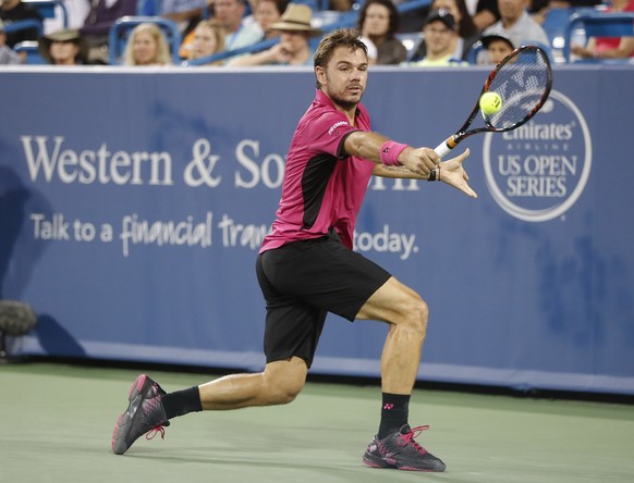 Stan Wawrinka, of Switzerland, returns to Jared Donaldson, of the United States, during the Western &amp; Southern Open tennis tournament, Tuesday, Aug. 16, 2016, in Mason, Ohio. (AP Photo/John Minchi ...