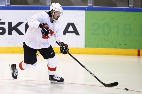 Switzerland&#039;s defender Jonas Siegenthaler shoots a puck, during a Swiss team training optional session, at the IIHF 2018 World Championship, at the practice arena of the Royal Arena, in Copenhage ...